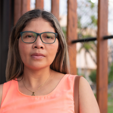 hispanic-business-woman-outdoors-with-glasses-scaled 1